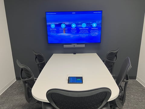 Huddle room at Extensiv with a wall-mounted display