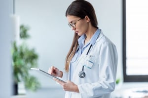 Female doctor using her digital tablet