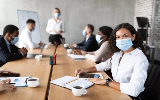 businesswoman-in-face-mask-sitting-attending-corpo-CERRTY2-2