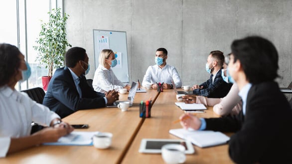 people-in-face-masks-sitting-during-corporate-meet-A4S4S5H-1