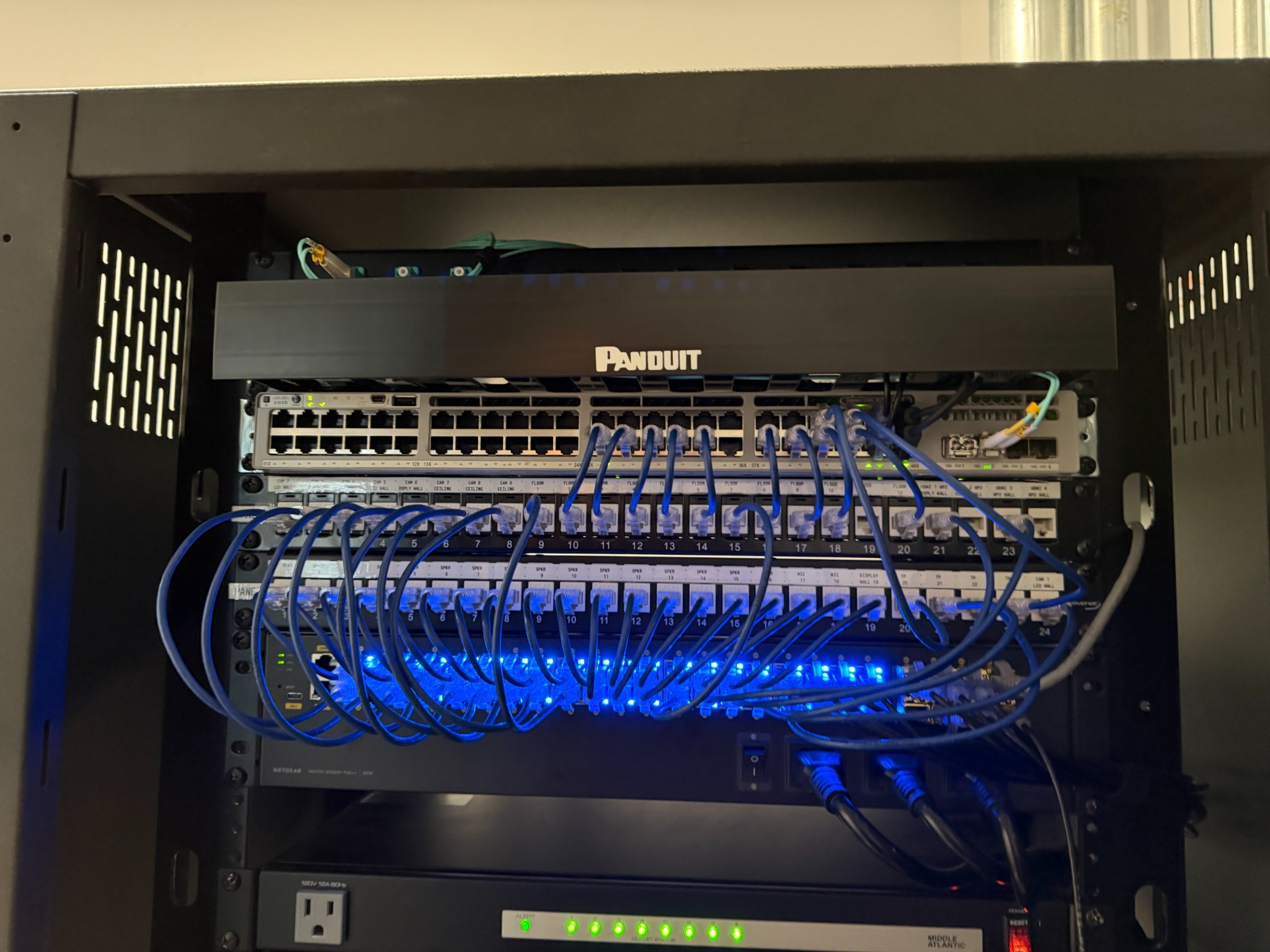 Structured cabling and network equipment in the Mattel Malibu multipurpose room AV rack