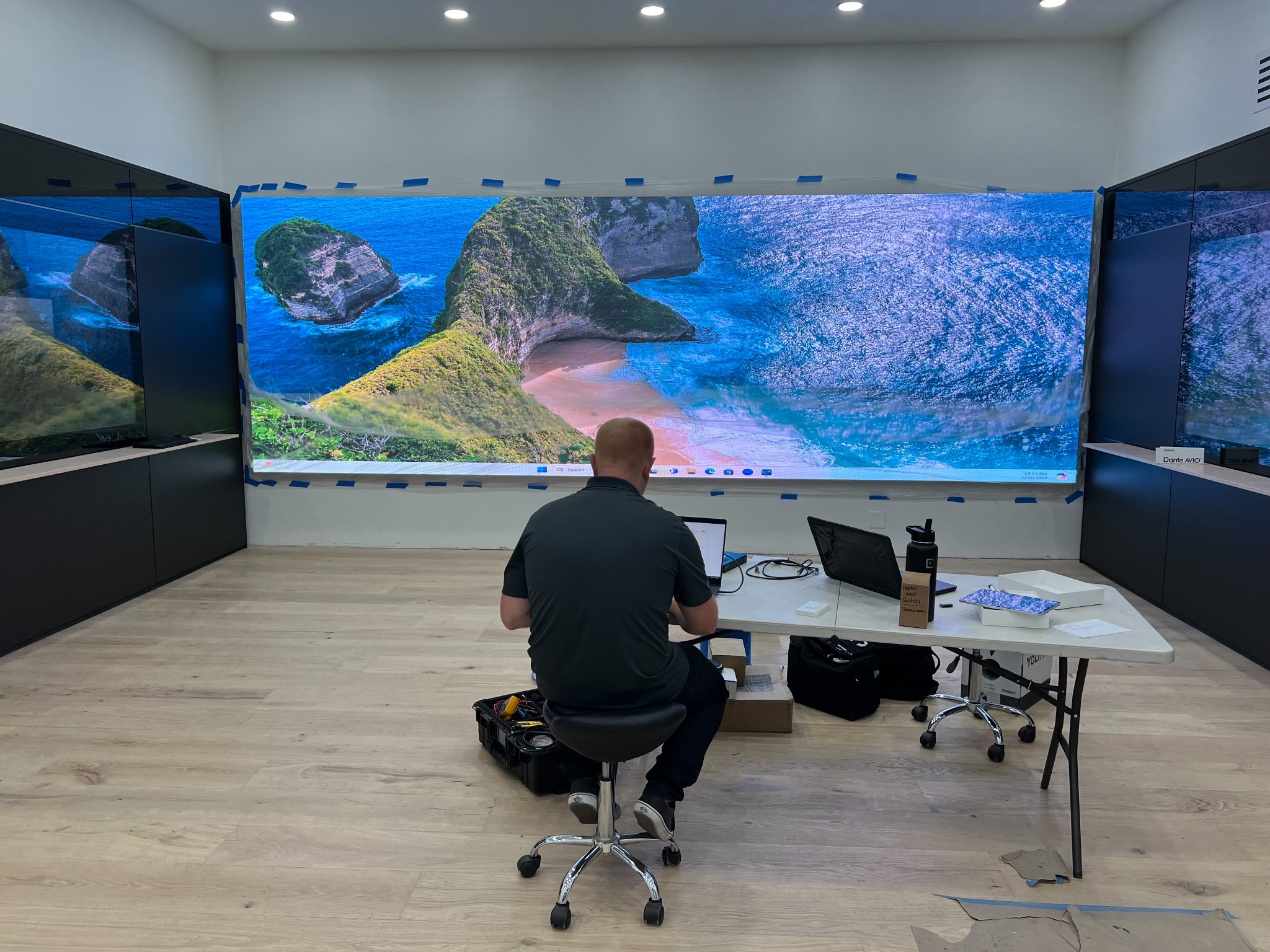 LED video wall displaying a coastal landscape in the Hotel Emporium showroom