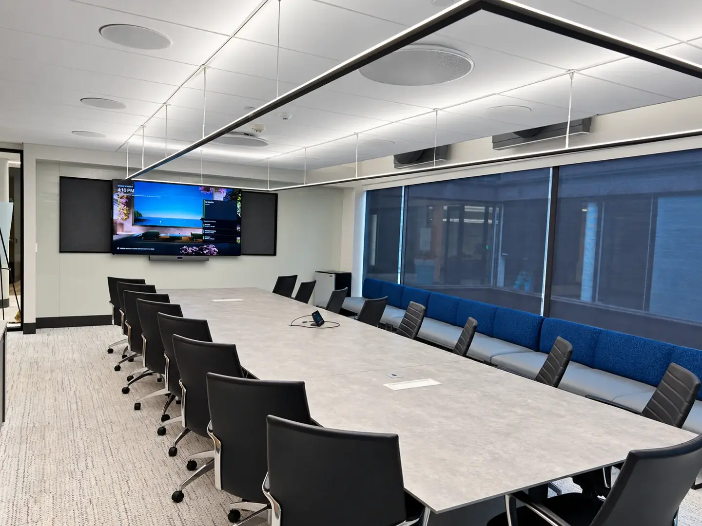 Spin Master New York conference room with video display, ceiling audio and tabletop touch controller