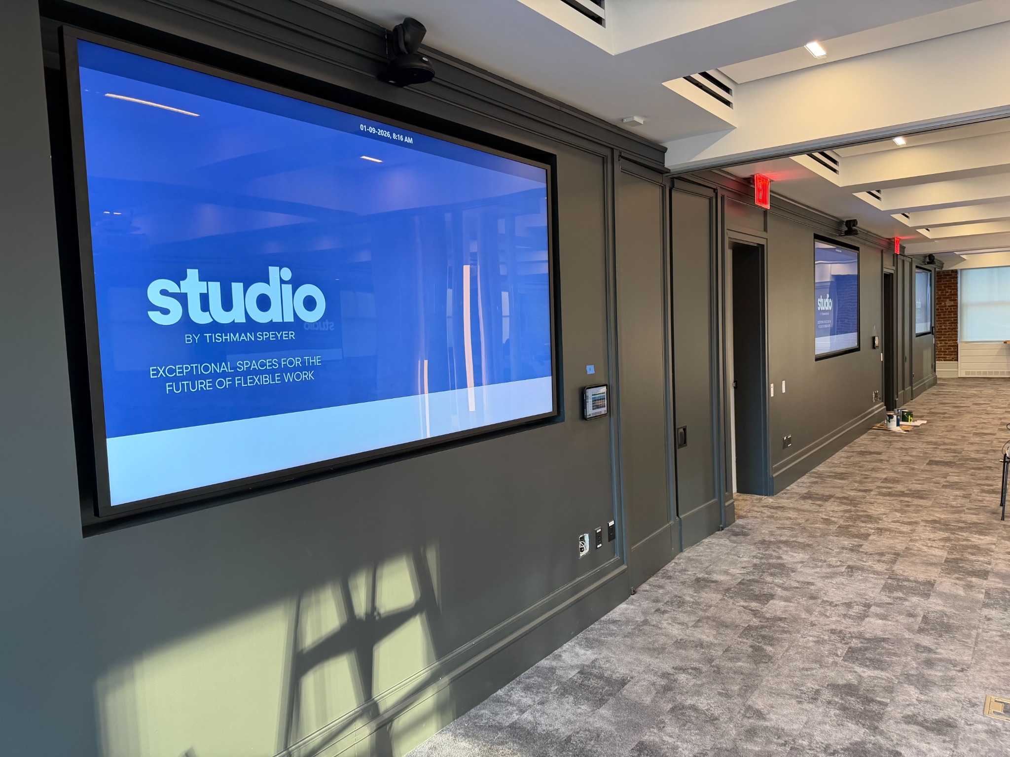 Large commercial displays in a Studio by Tishman Speyer meeting space at 45 Rockefeller Plaza
